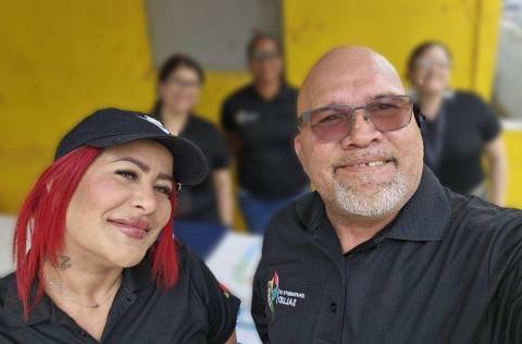 A woman with red hair and a bald man with glasses and a gray beard are peer navigators in Puerto Rico