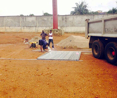 Workers prepare the site of the future home for Sierra Leone’s emergency operations center in Freetown.