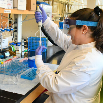 Person using lab equipment