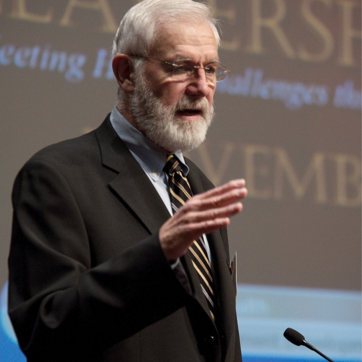 A person giving a speech at a podium