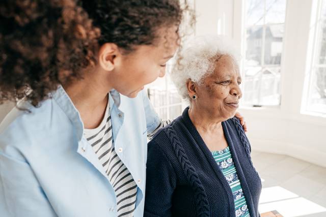 elderly person with caregiver