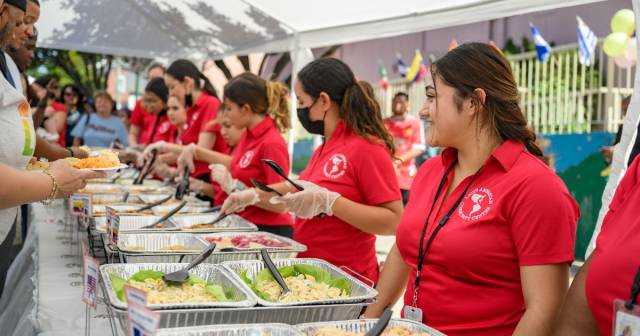 Members of LACC serve food to the community
