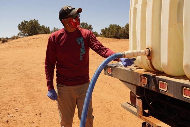 Man filling tank