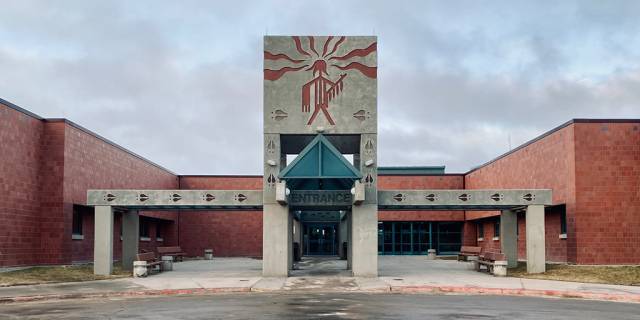 A rural hospital with a Lakota image on the front of the building.