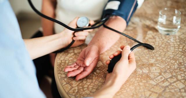 White person getting blood pressure checked