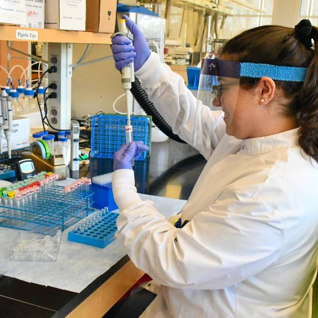 Woman in Lab Coat