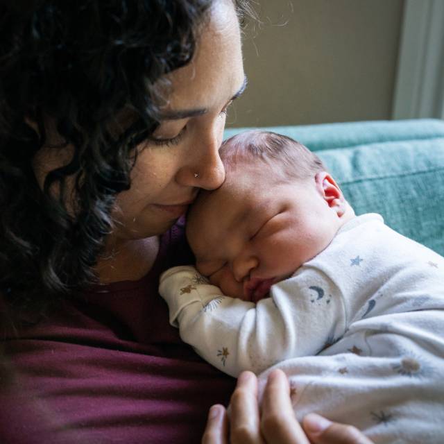Mother holding newborn baby