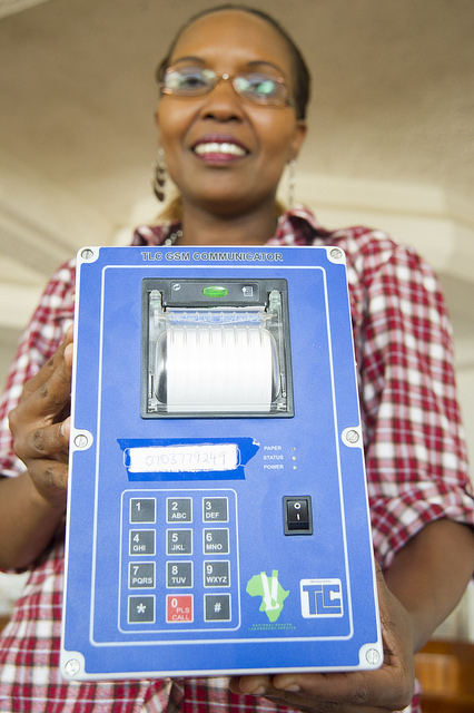  Dr. Cathy Mwangi, head of the CDC Foundation-funded MPEP initiative, poses with an SMS printer